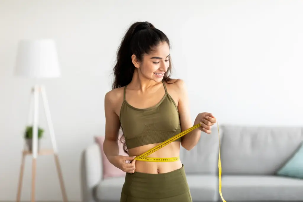 Woman smiling during personalized weight management program in Jericho, NY | Restoration Health 365