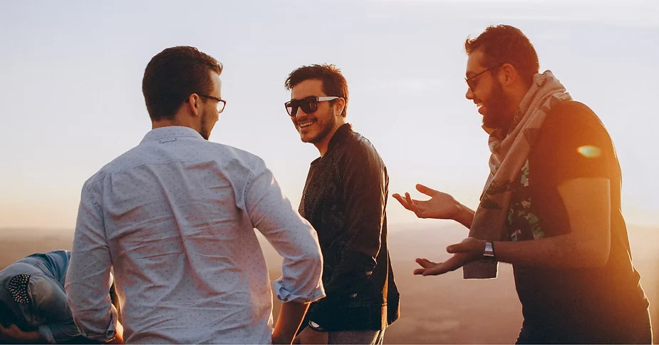 Two men talking outdoors about men's wellness | Restoration Health 365 in Jericho NY
